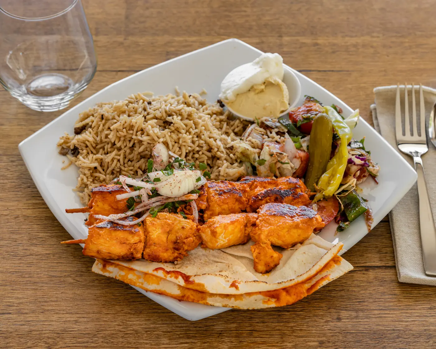 Chicken shish platter with rice, salad and flatbread